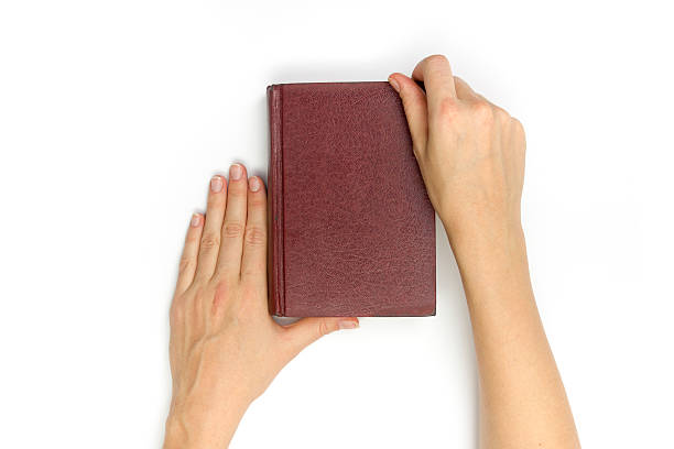 istock Hands hold blank red hardcover book on white background 509661732