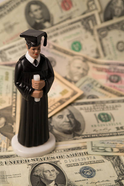 High Cost of Education (Concept) with Male Figurine stock photo