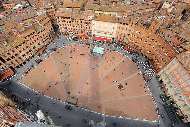 Piazza del Campo, Siena, Italy Aerial view of the Piazza del Campo, Siena, Tuscany, Italy as seen through a wide angle lens from the Torre del Mangia. torre del mangia stock pictures, royalty-free photos & images