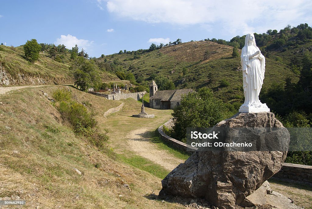 Our Lady of Alleuze Small basilica and Notre Dame next to Alleuze castle, France Auvergne Stock Photo