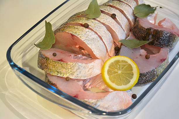 istock Appetizing sliced fish in a glass tray with the spices 509665444