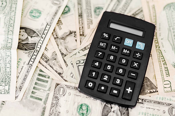 istock black calculator on top of stack of dollar bills 509665920
