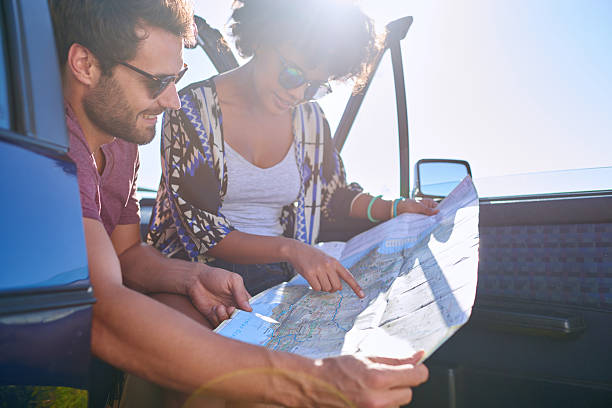 istock Young lovely couple using  map during roadtrip 509666048
