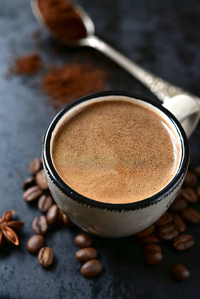 istock Cup of spicy coffee with coffee beans and ground coffee. 509668078