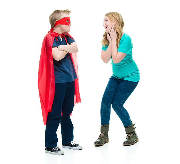 istock Little girl looking at superhero 509668786