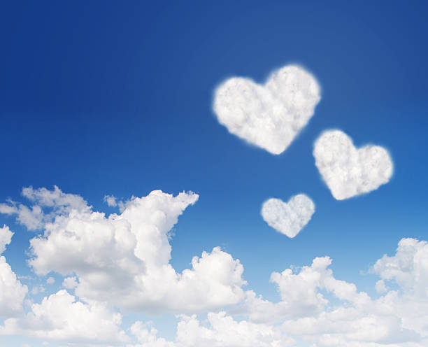 istock blue sky with hearts shape clouds. Love concept 509672318