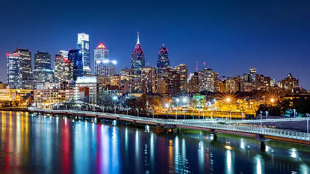 Philadelphia skyline by night reflected in Schuylkill river