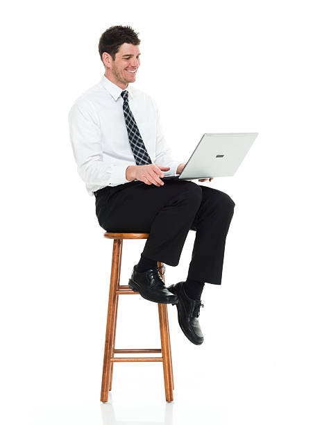 istock Smiling businessman working on laptop 509672678
