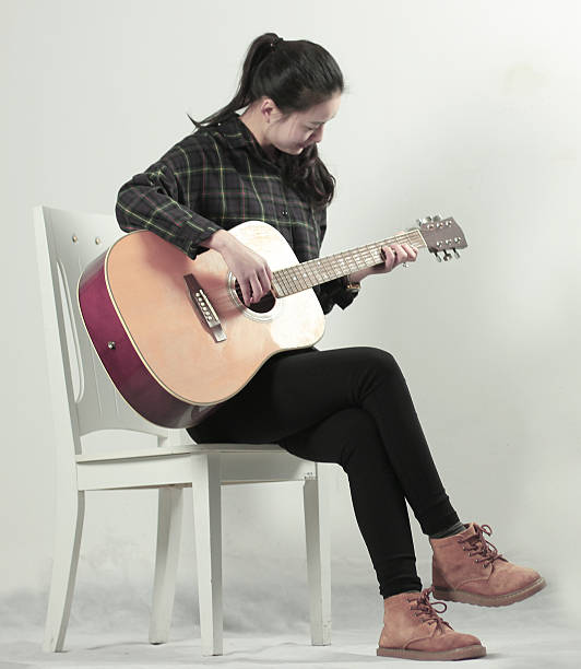 istock girl with guitar 509675554