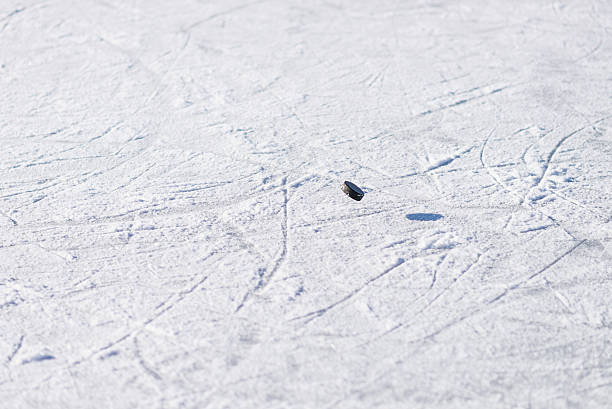 istock Hockey Puck Floating over Ice 509675984