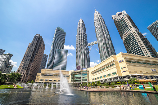 Kuala Lumpur, Malaysia - January 10, 2016: KLCC park, which contains the Petronas Towers and luxury hotels and shopping mall in Kuala Lumpur