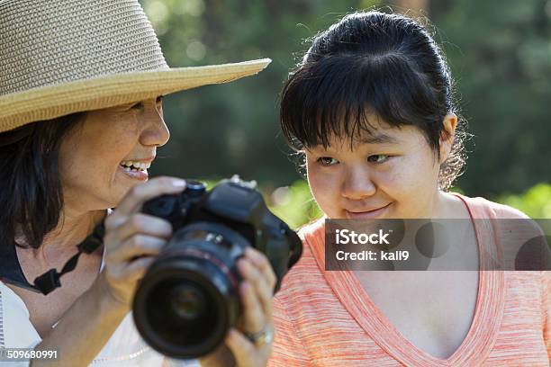 Mature Woman With Adult Autistic Daughter Stock Photo - Download Image Now - Autism, Adult, Camera - Photographic Equipment