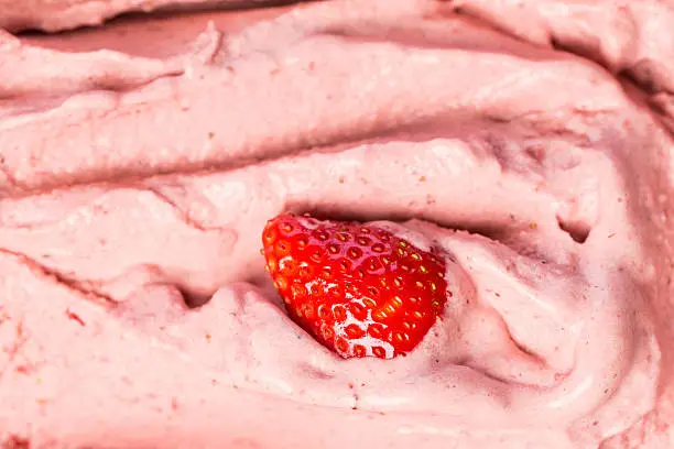 Photo of Creamy strawberry ice cream parlor in the window of icecreamshop