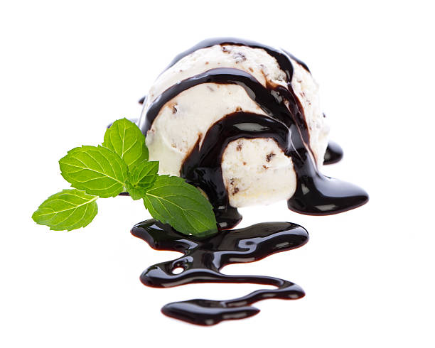 istock scoop of stracciatella ice cream with chocolate sauce and mint 509681278