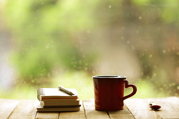 istock Red heart mug shaped and notebooks at windows 509682212