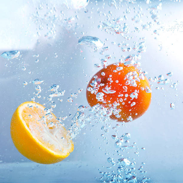 istock slices of  orange and  lemon  in  water with bubbles 509682626