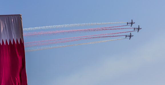 Doha, Qatar - December 18, 2015: Qatar Air Force jets perform during Qatar National Day celebrations in Doha on 18th of December 2015.