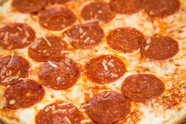 istock Hot Greasy Cheesy Pepperoni Pizza Closeup 509683951