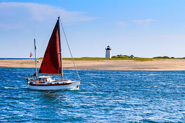long point light and sailboat long point light and sailboat cape cod stock pictures, royalty-free photos & images