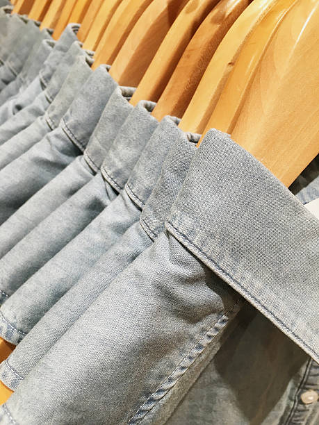 istock Clothes hang on a shelf in a designer clothes store 509685486