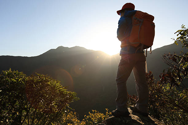 istock successful woman hiker on sunrise mountain peak 509685694
