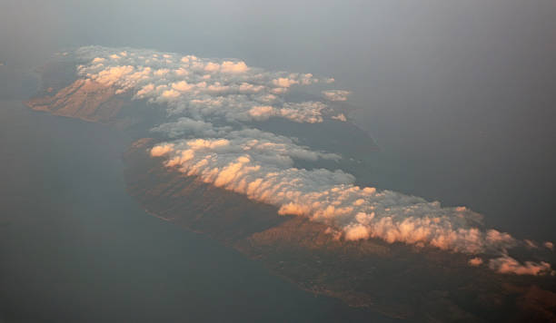 Greek island Icaria covered with clouds Greek island Icaria covered with clouds ikaria island stock pictures, royalty-free photos & images