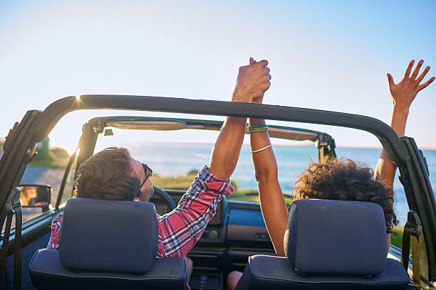 istock Young couple sitting in their car during roadtrip 509687400