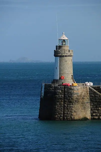 Telephoto image of a lighthouse at the end of the harbour breakwater down from Castle Cornet.