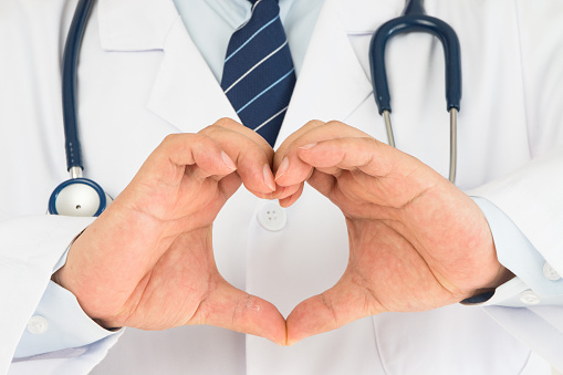Doctors hands making heart-shaped