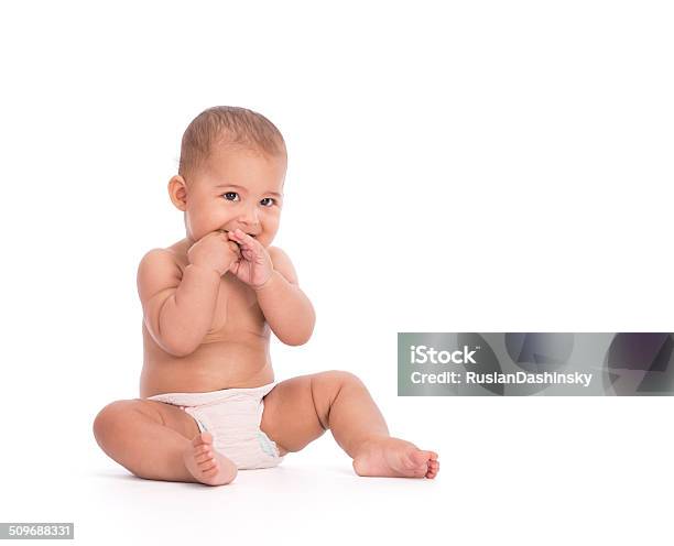 Portrait Of Shy Baby With Both Hands In Mouth Stock Photo - Download Image Now - White Background, Baby - Human Age, Hungry
