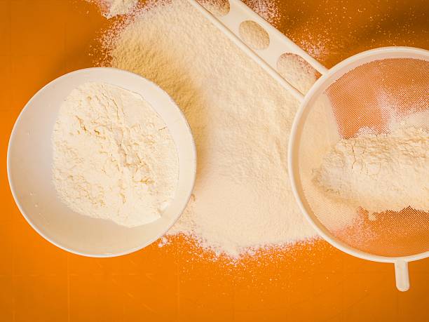 Preparation for baking, ingredients flour sifting.
