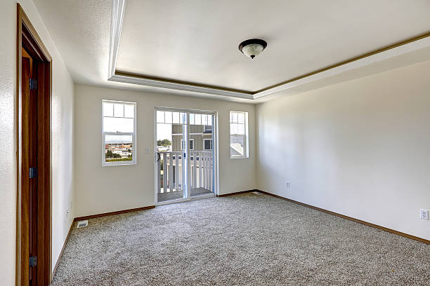 istock Empty room with brown carpet floor and walkout deck 509699991