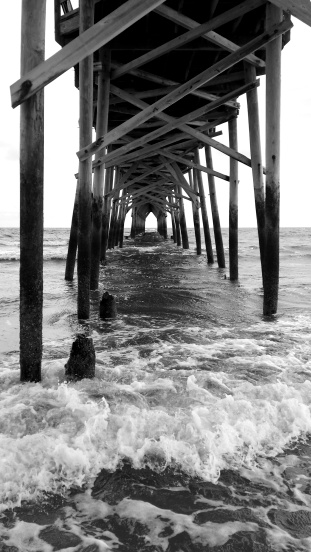 Under the pier at Holden Beach, North Carolina looking towards the ocean.