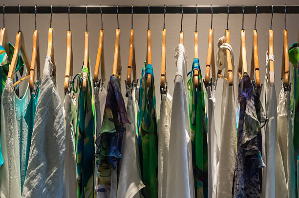 istock High-class women's clothes hangs in a row from a metal rod. 509701041