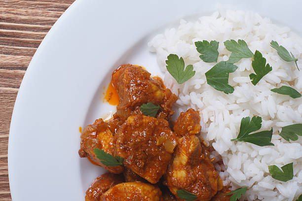 istock Rice with chicken curry on a plate close-up top view 509704167