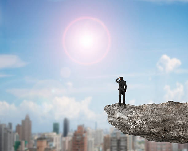 istock Rear view businessman standing gazing on cliff 509709224