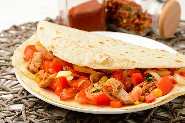 istock Tortilla wrap with meat and vegetables. 509711252