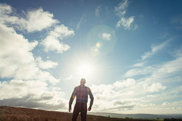 istock man in nature with Sun Flare 509712058