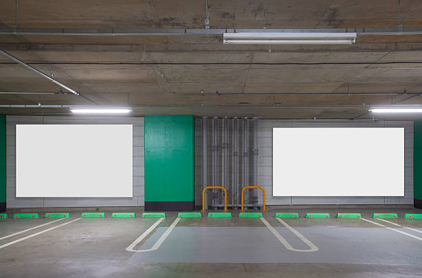 istock Parking garage underground interior with blank billboard 509712534