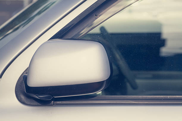 istock Side rear-view mirror closed for safety at car park 509712588