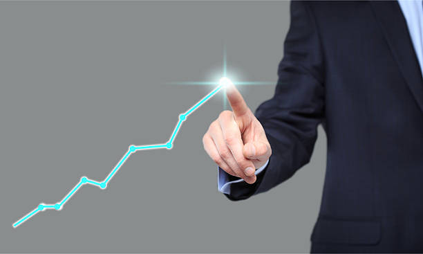 istock Businessman Touching a Graph Indicating Growth 509713884