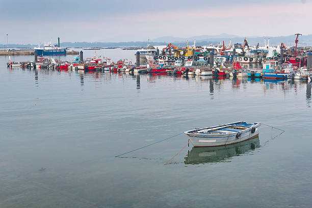 istock Fishing vessels moored in the port 509714966