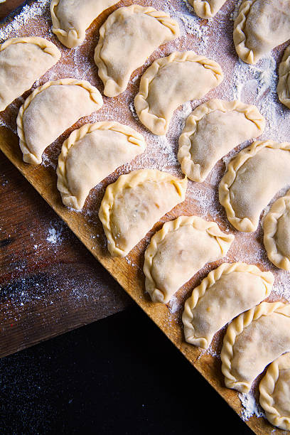istock Vareniki with cabbage ( dumplings ) , pierogi before boiling 509716272