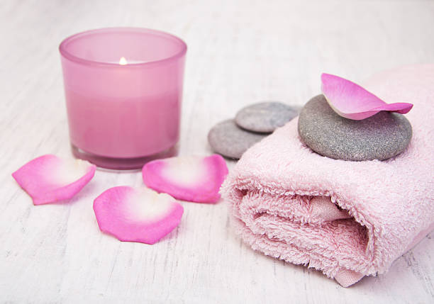 istock Bath towels and candle with pink roses 509719804