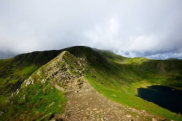 Striding Edge and Helvellyn The track of Striding Edge to Helvellyn striding edge stock pictures, royalty-free photos & images