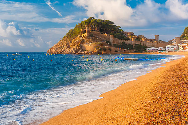 Tossa de Mar on the Costa Brava, Catalunya, Spain Sand Gran Platja beach and fortress in the morning in Tossa de Mar on Costa Brava, Catalunya, Spain tossa de mar stock pictures, royalty-free photos & images