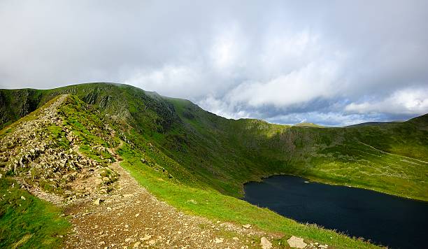 Striding Edge and Helvellyn The track of Striding Edge to Helvellyn striding edge stock pictures, royalty-free photos & images