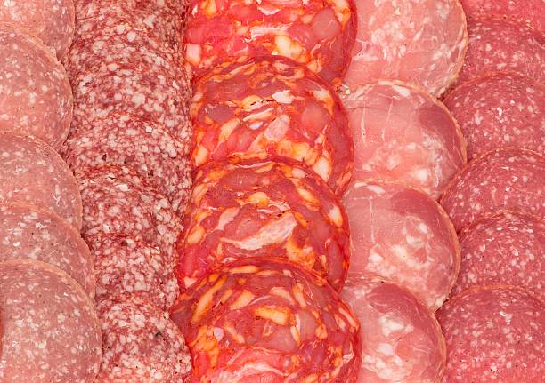 istock Variety of sliced salami as background. 509721074