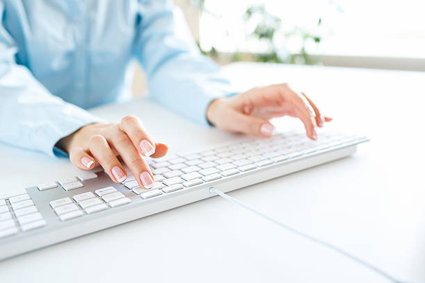 istock Woman office worker typing on the keyboard 509721194