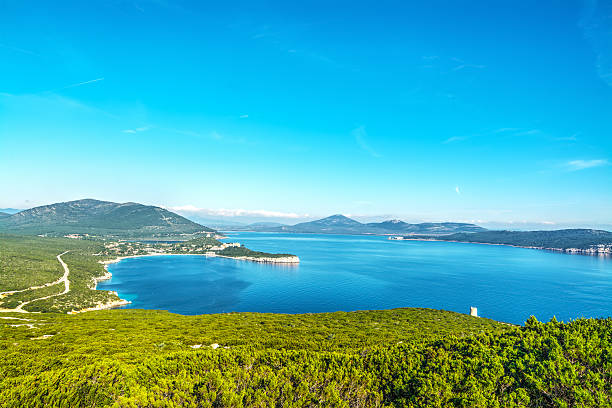 istock Porto Conte shoreline on a clear sunny day 509721742
